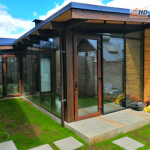 Cierre Quincho Tipo Muro Cortina Trama Escondida, Termopanel laminado,trabajo realizado en PVC color Nogal